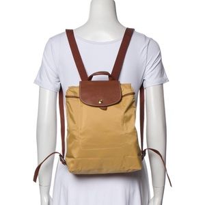 Longchamp “Le Pliage” yellow nylon backpack